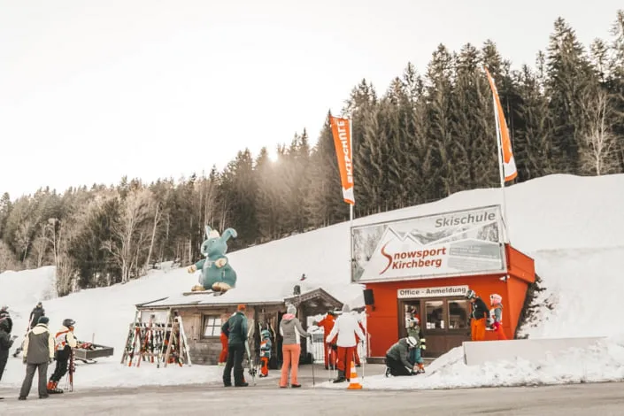 Ski school in Kirchberg with skiers and snow.