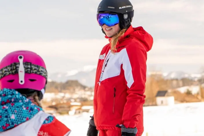 Skiier and child on the slope in Kirchberg.