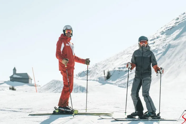 Two skiers on the slope in Kirchberg